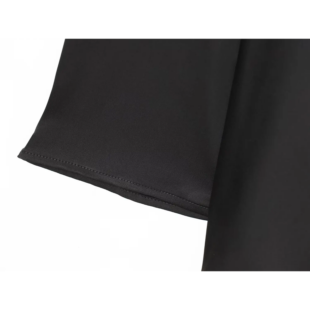Close-up of black flared cuff stitching