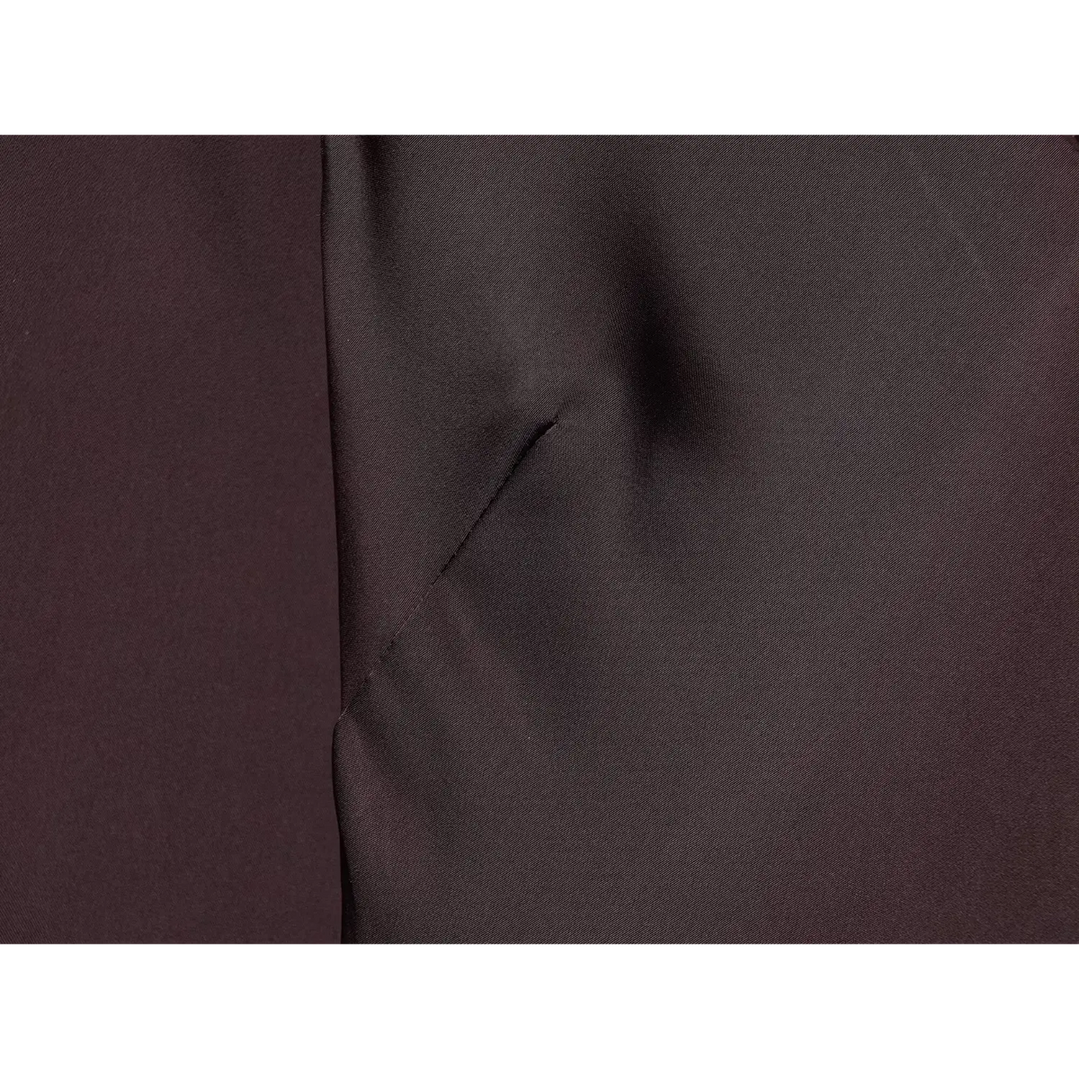 Close-up of burgundy underbust dart detail