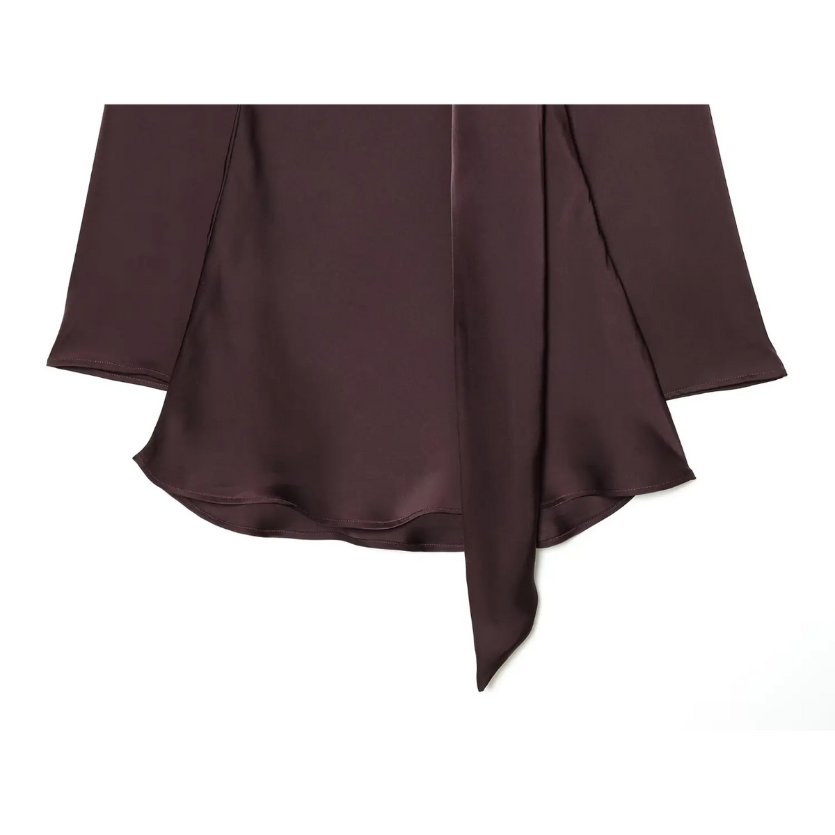 Close-up of burgundy A-line hem and hanging scarf tie
