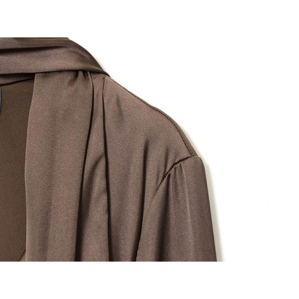 Close-up of mocha brown shoulder seam and flared sleeve