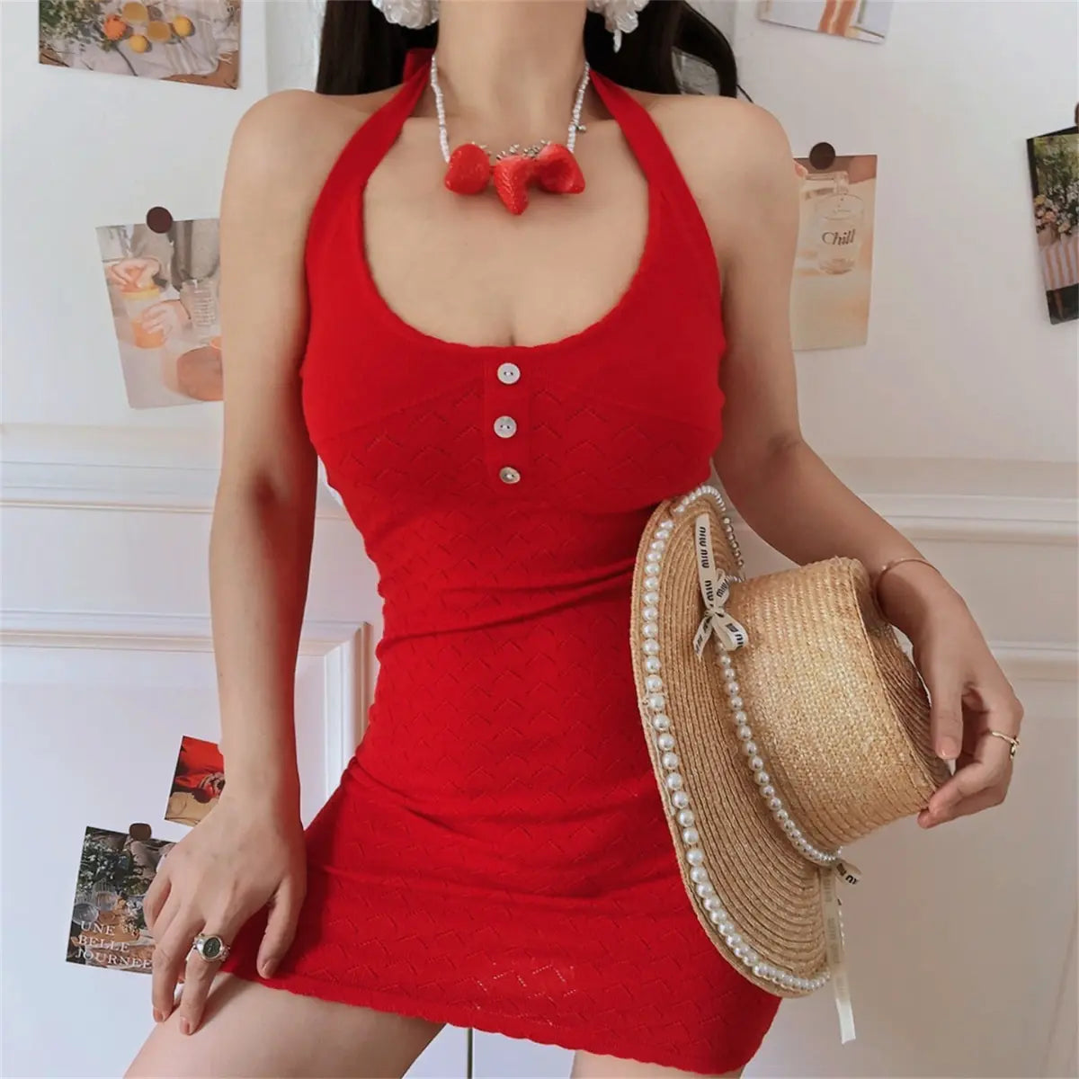 Side lifestyle view of red chevron hollow knit halter bodycon dress, slim short skirt and back tie halter design.