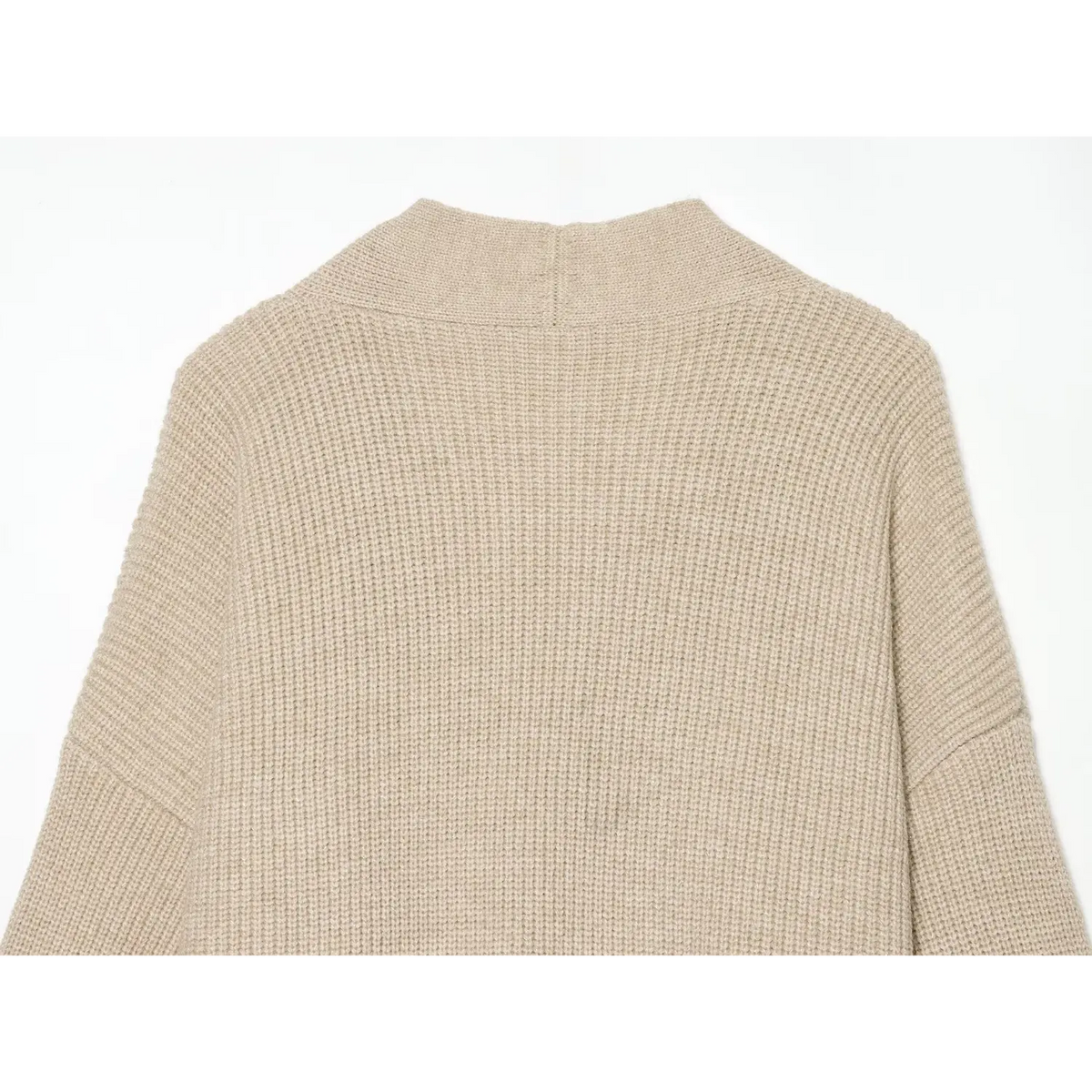 Close-up of beige back neckline and drop shoulder seams
