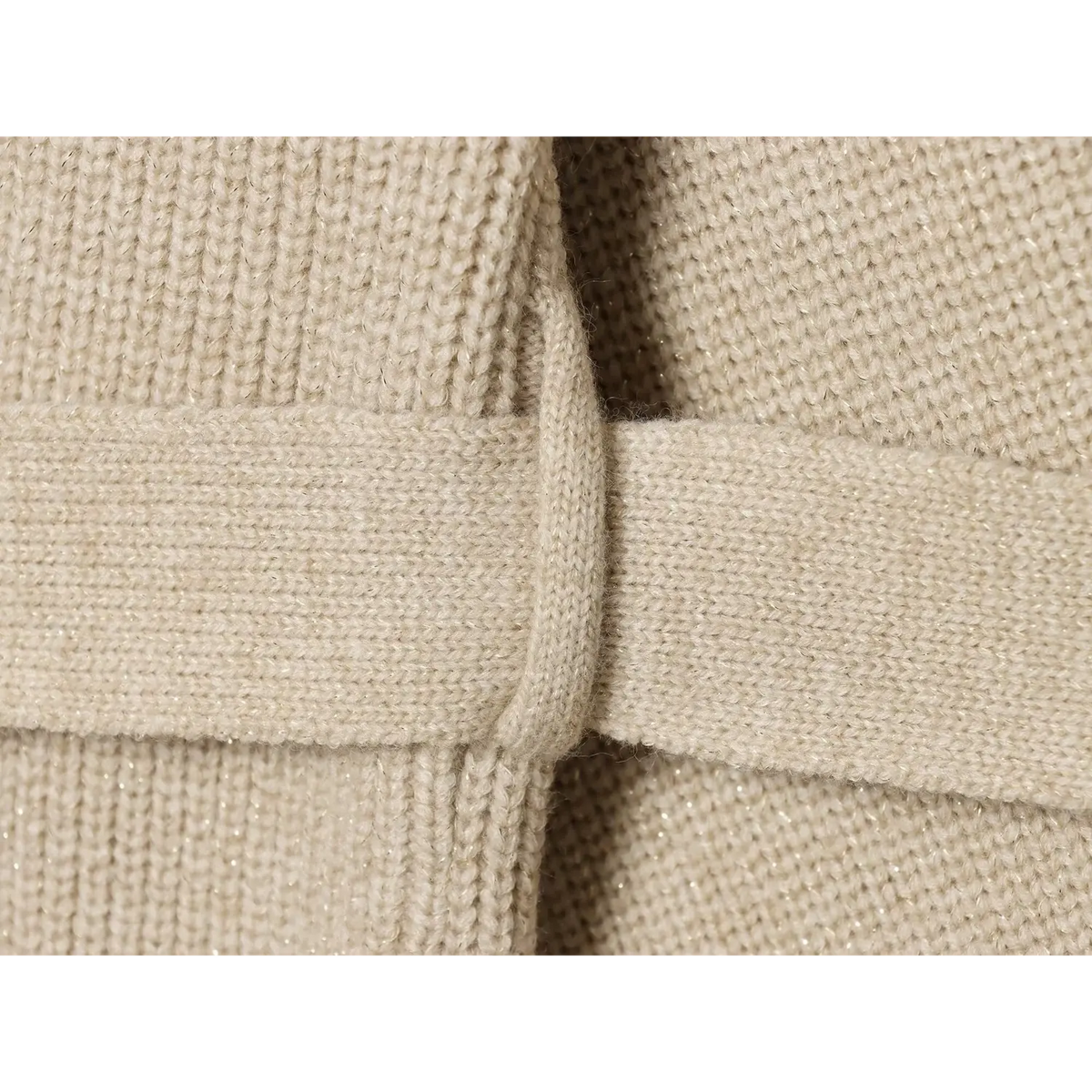 Close-up of matching knit belt threaded through front placket
