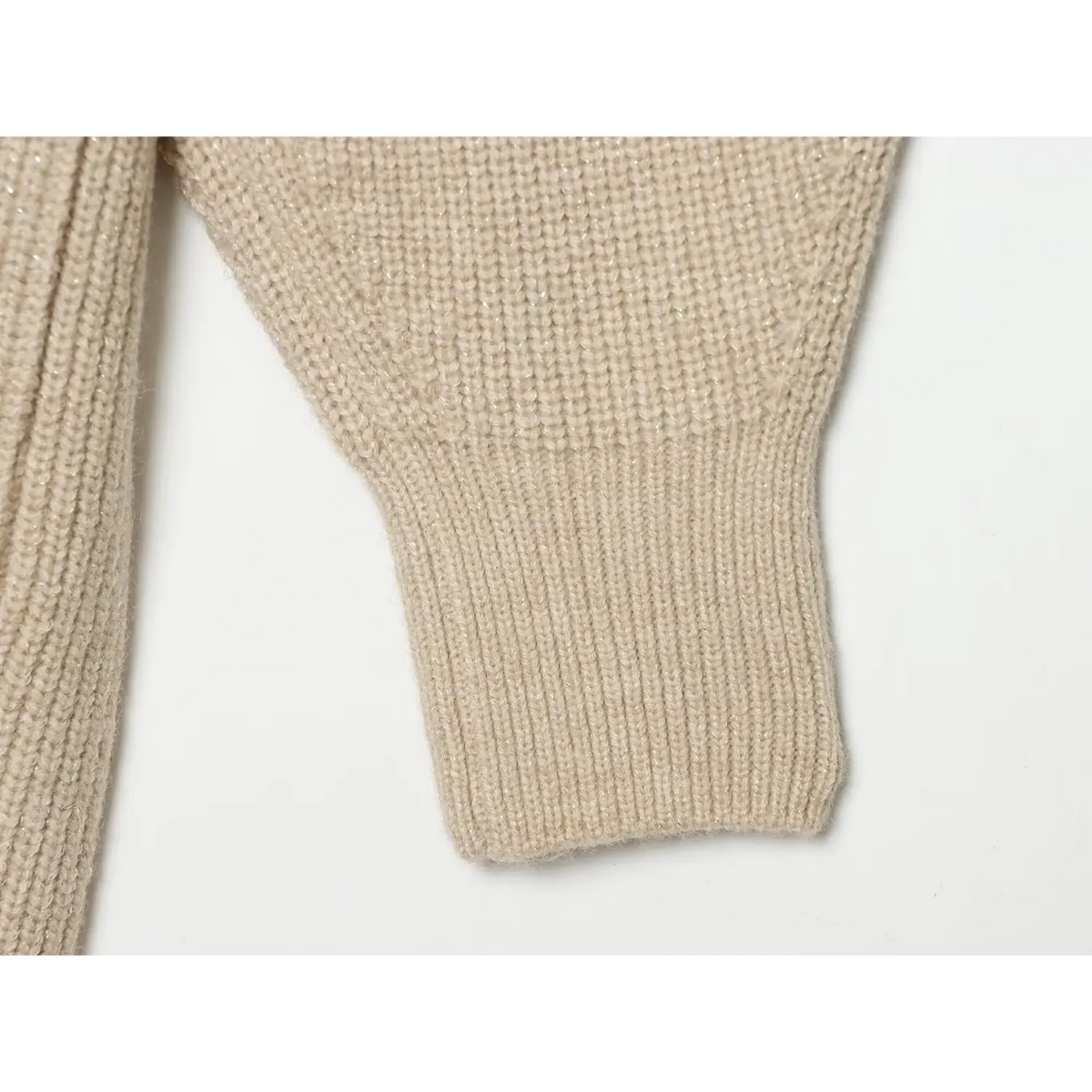 Close-up of ribbed cuff on drop shoulder balloon sleeve