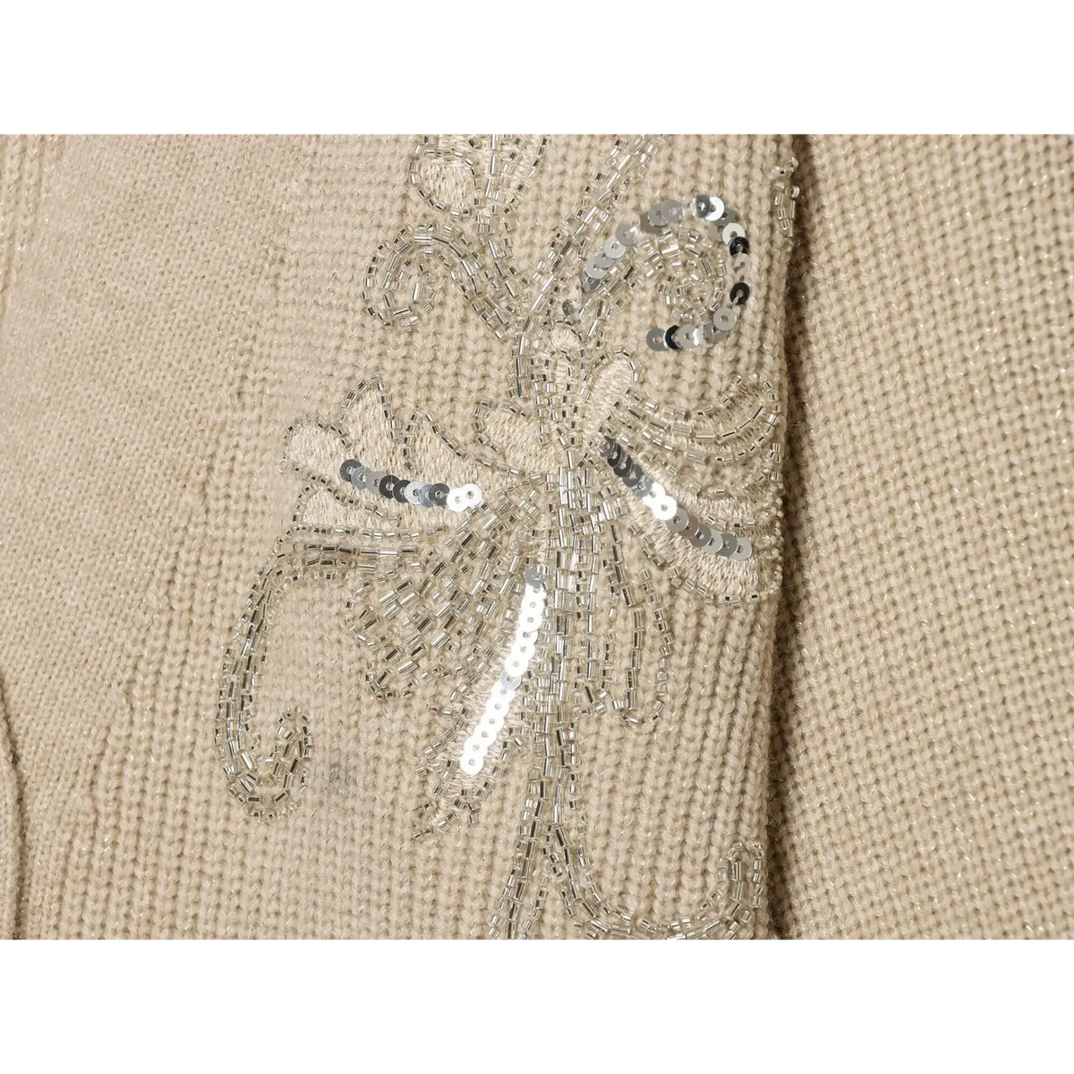 Close-up of silver sequin and bugle bead floral vine embroidery detail