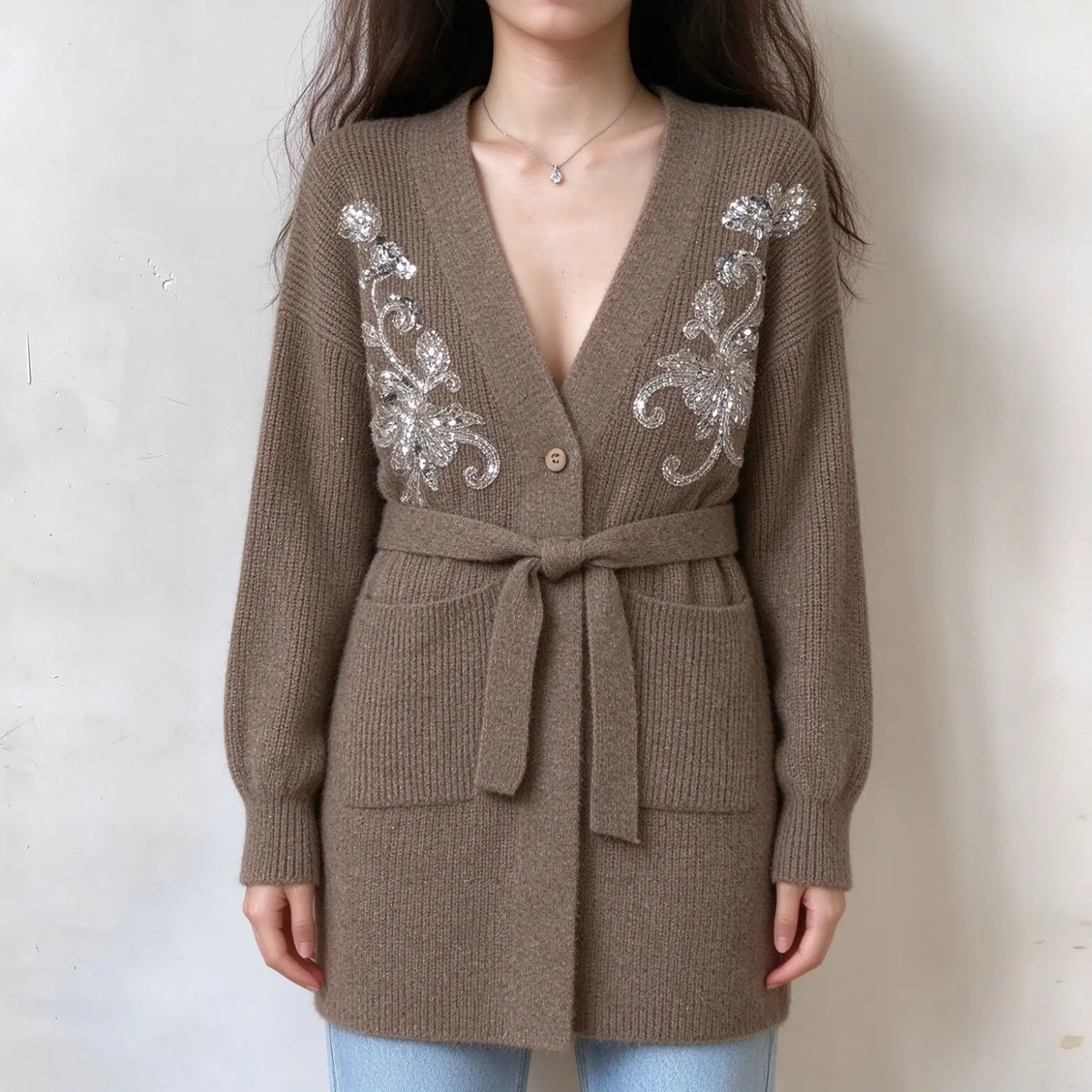 Model wearing camel sequin embroidered belted long cardigan, front view