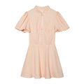 Shell Pink polka dot mini dress front view,puff short sleeve,stand collar,keyhole neck,front faux buttons,feminine fit‑flare silhouette