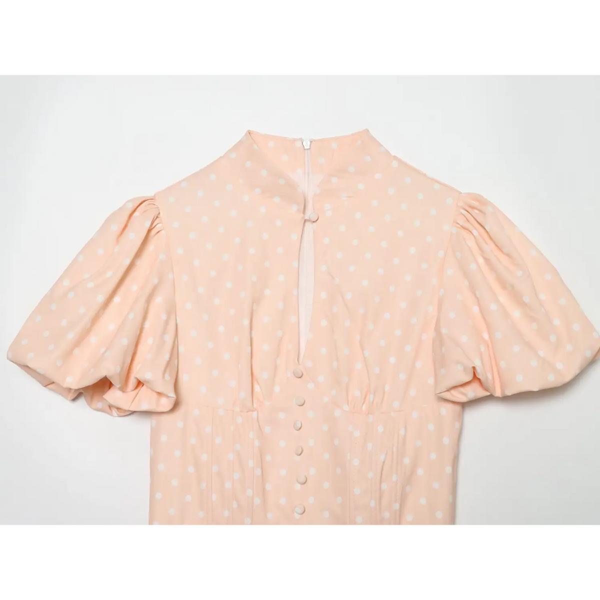 Shell pink white polka dot dress front partial view,stand collar,puff short sleeve,faux button bodice,back zipper