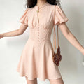 Shell pink white polka dot mini dress on model,stand collar puff sleeve fitted waist flared skirt,vintage women outfit