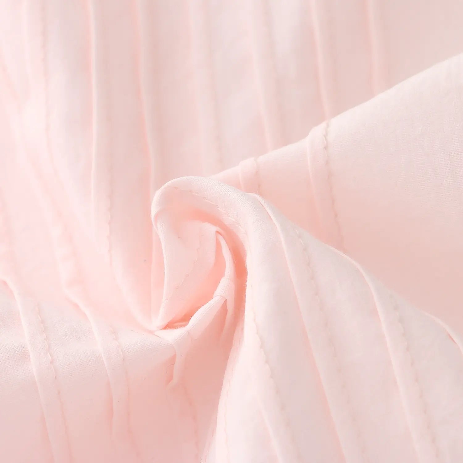 Front full vertical pleated tucks macro close-up, uniform dense parallel folds strong three-dimensional layering long lasting shape retention bust pleating craft shot