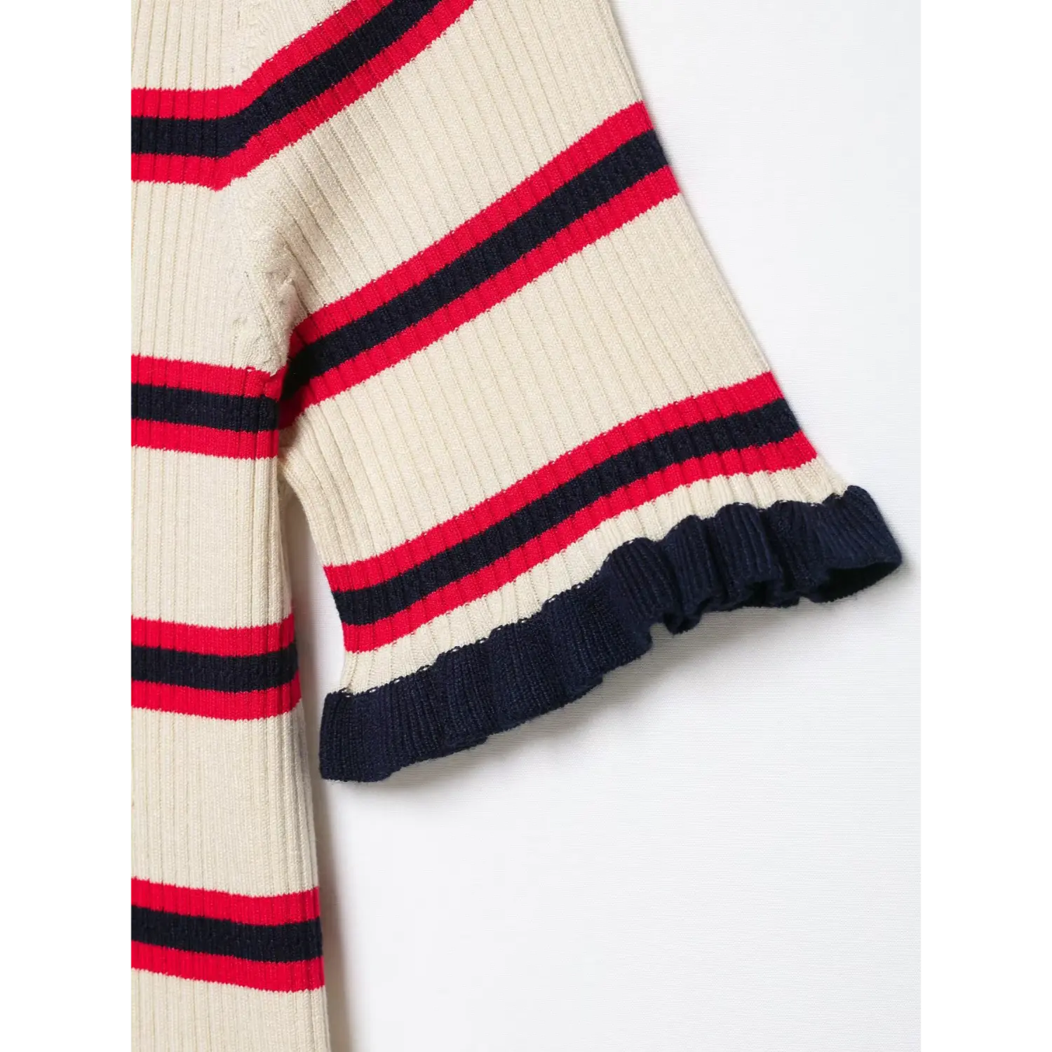 Sleeve hem close-up, navy ruffled scalloped cuff, striped rib knit fabric, lightweight summer knit texture