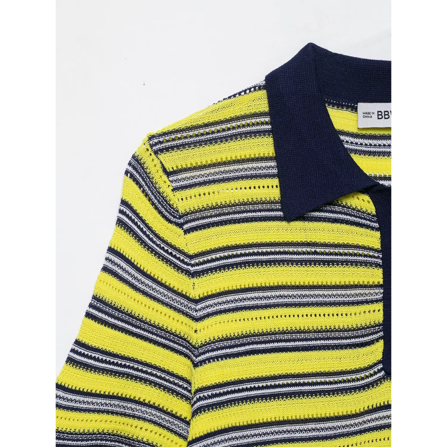 Shoulder partial view, contrast navy collar, shoulder seam, yellow white navy horizontal striped openwork knit