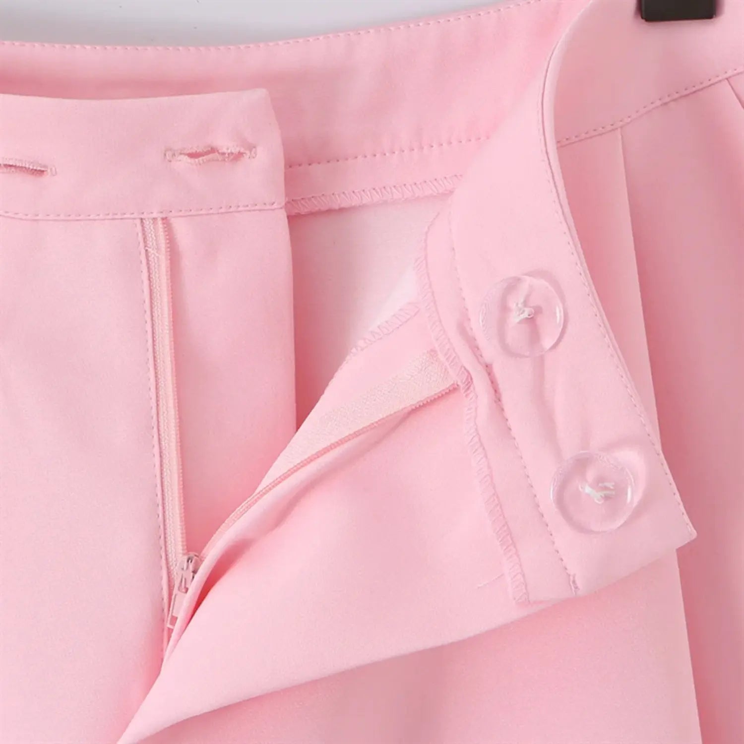 Side seam macro shot, hidden zipper placket, inner transparent buttons, neat serging and waistband binding