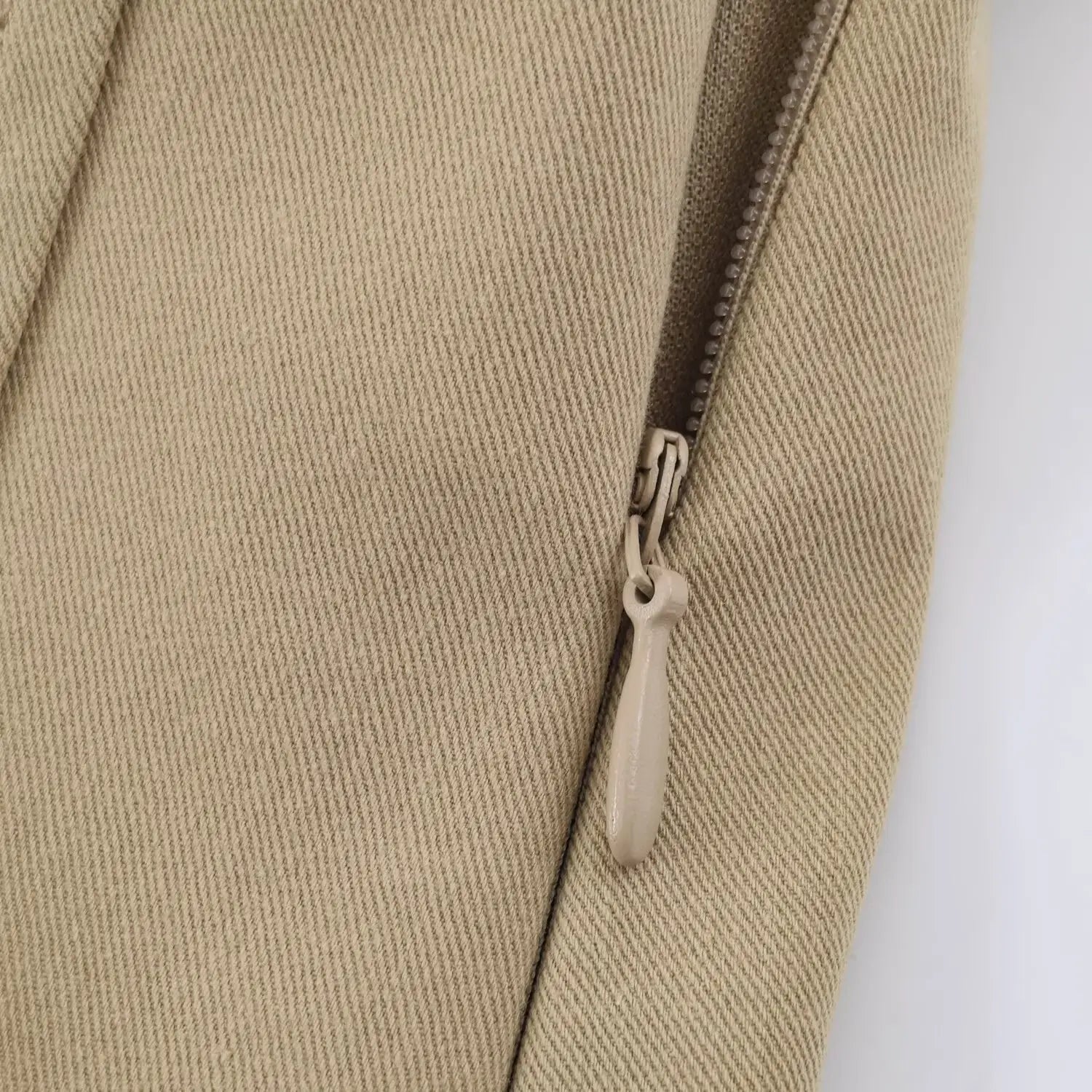 Side invisible zipper with matching khaki fabric pull tab for easy wear mini dress