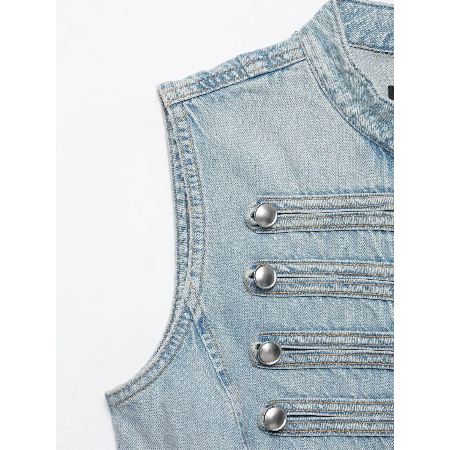 Side view silver button strap decoration on light wash sleeveless denim vest