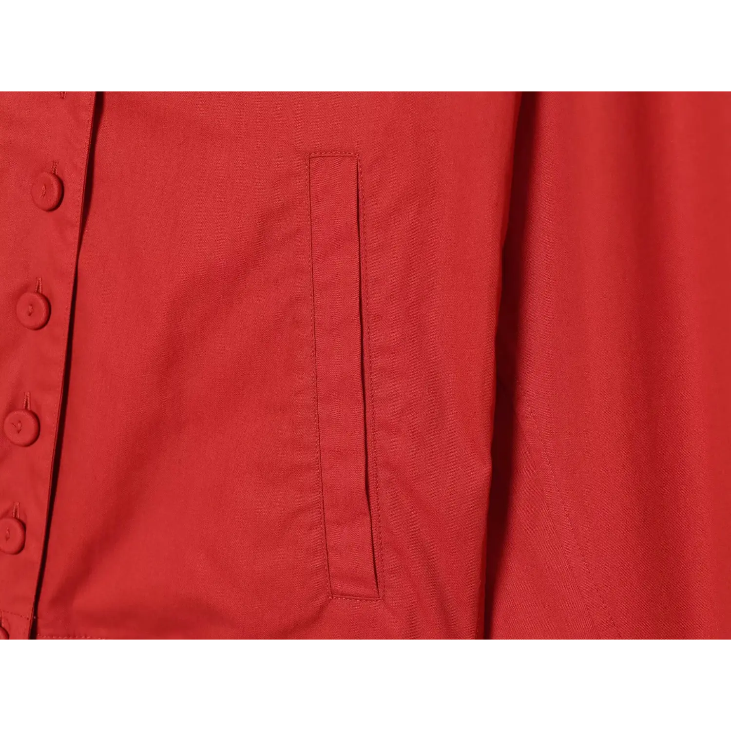 Side patch pocket stitching macro close-up, double reinforced topstitch large capacity pocket stiff non-collapse utility fabric craft shot