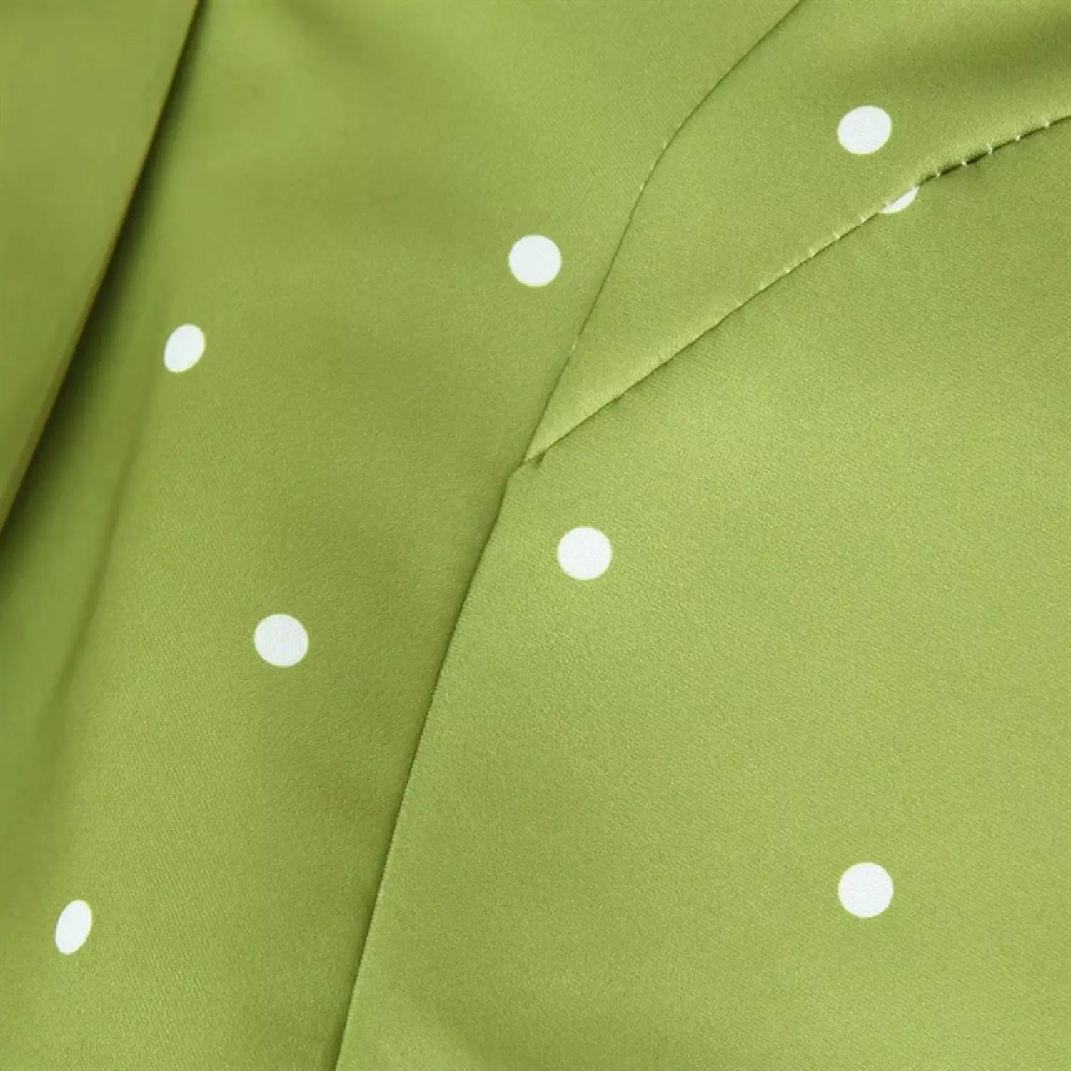 Macro close-up of side waist shaping dart stitching, segmented panel cut, transition seam connecting waist and flared hem