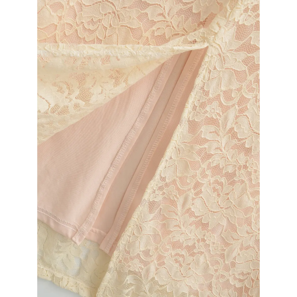 Detailed close‑up of side seam hidden zipper and fabric stitching