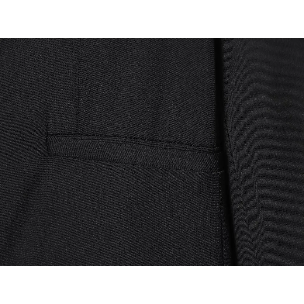 Close-up of black twill fabric and welt pocket