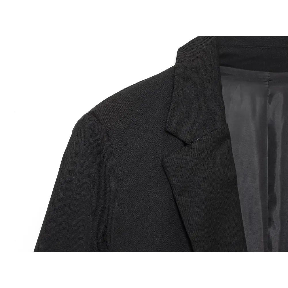 Close-up of black lapel, shoulder seam and twill fabric