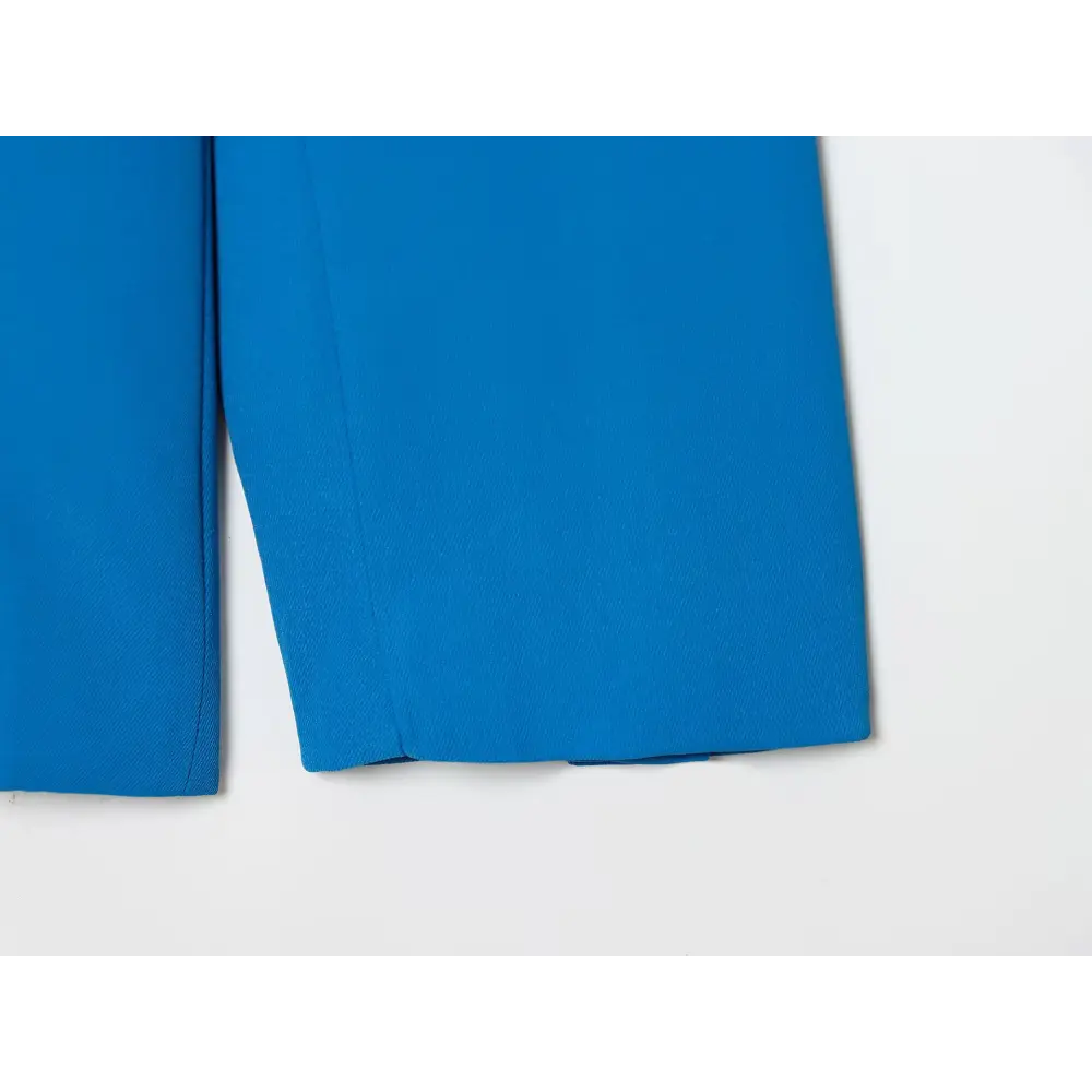 Close-up of blue blazer hem detail