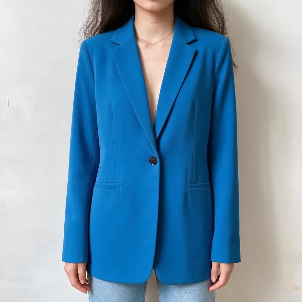 Model wearing bright blue single button notch lapel blazer, front view