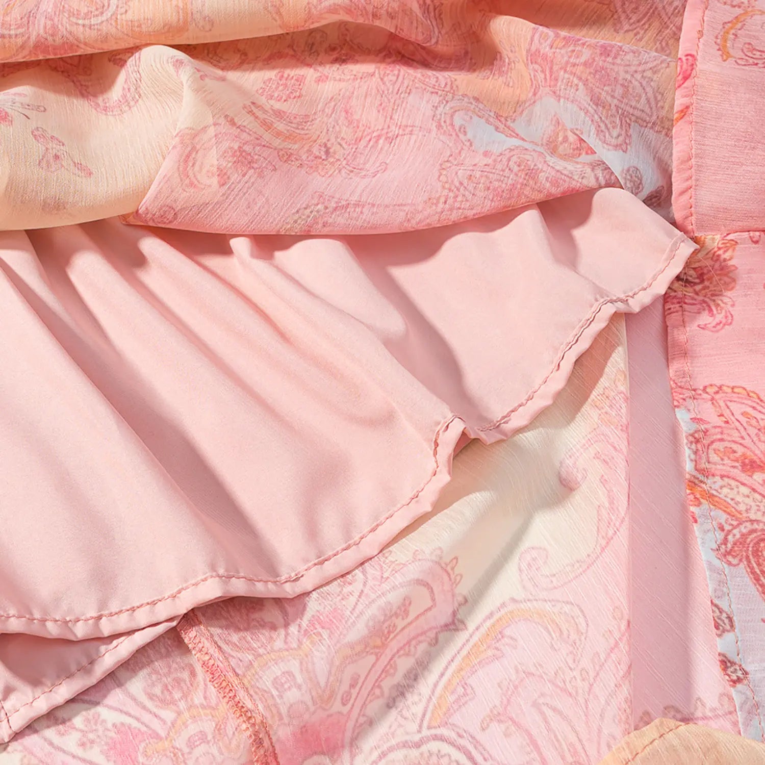 Skirt lining macro shot, solid light pink smooth inner lining, serged neat hem stitching