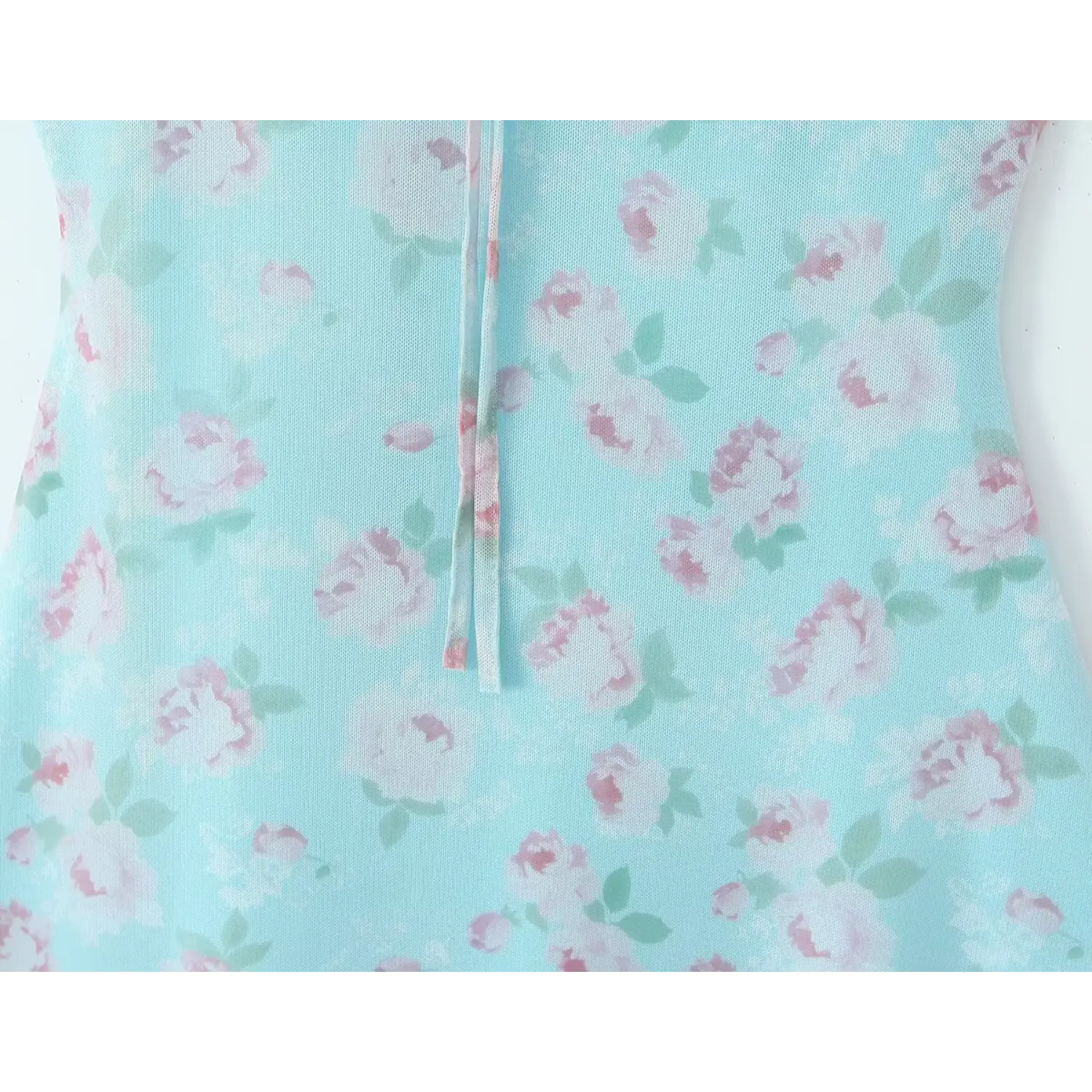 Close‑up of front tie and rose floral print on skyblue mesh dress fabric