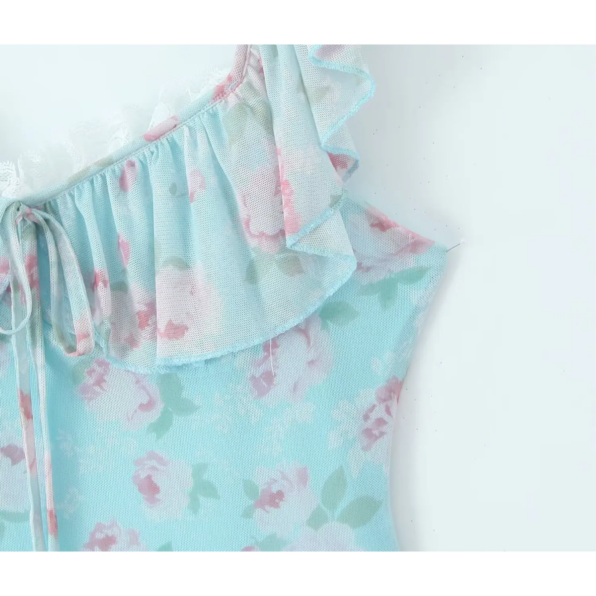 Close‑up of ruffle bust panel, lace trim and front tie of skyblue rose floral mesh dress