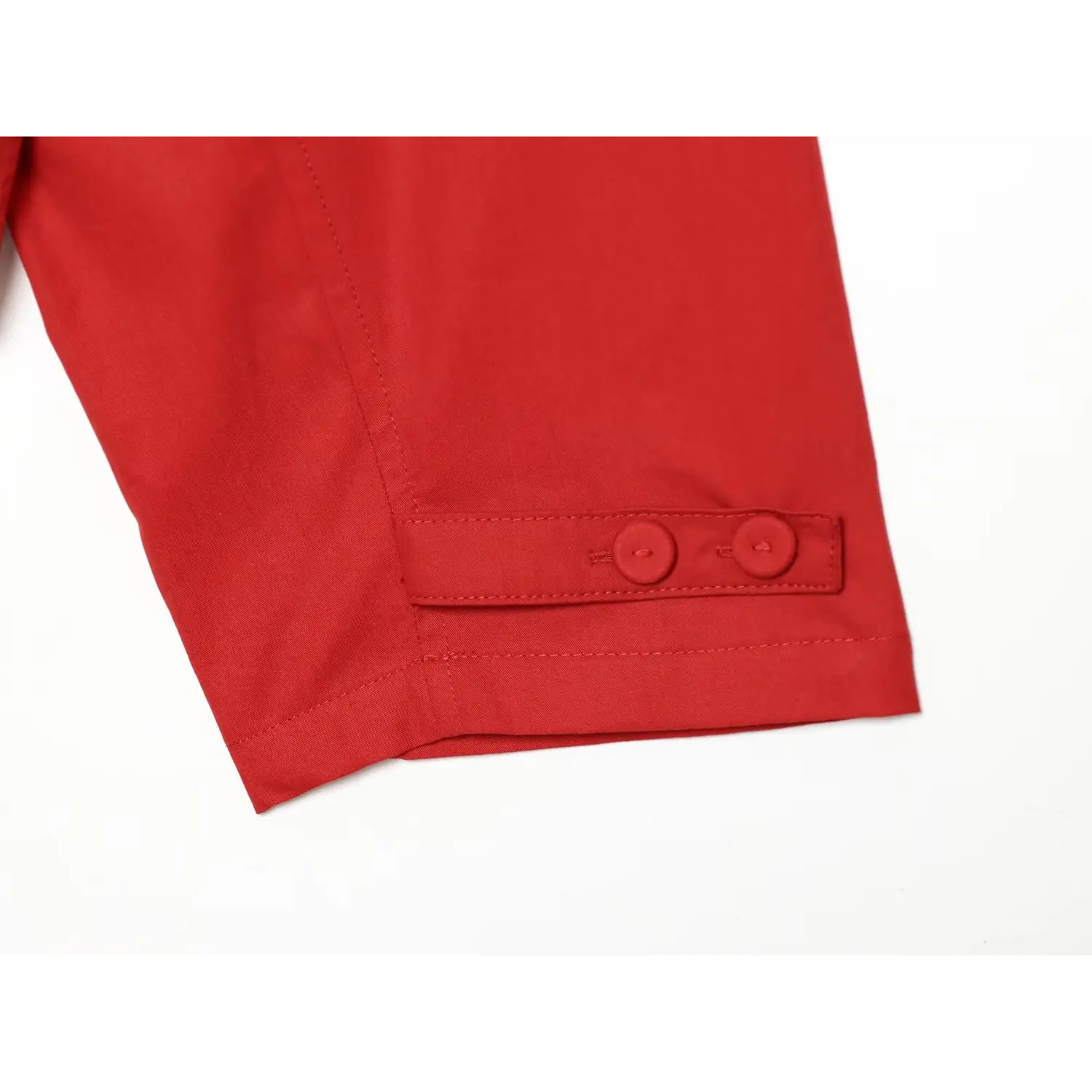 Long sleeve cuff double button macro close-up, adjustable cuff width matching fabric buttons durable neat hem stitching sewing detail shot