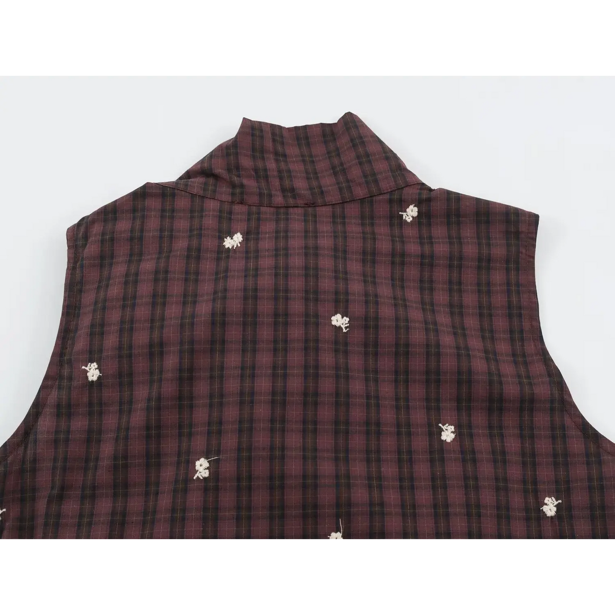 Back view of sleeveless plaid vest with high collar and scattered white floral embroidery on deep wine red check