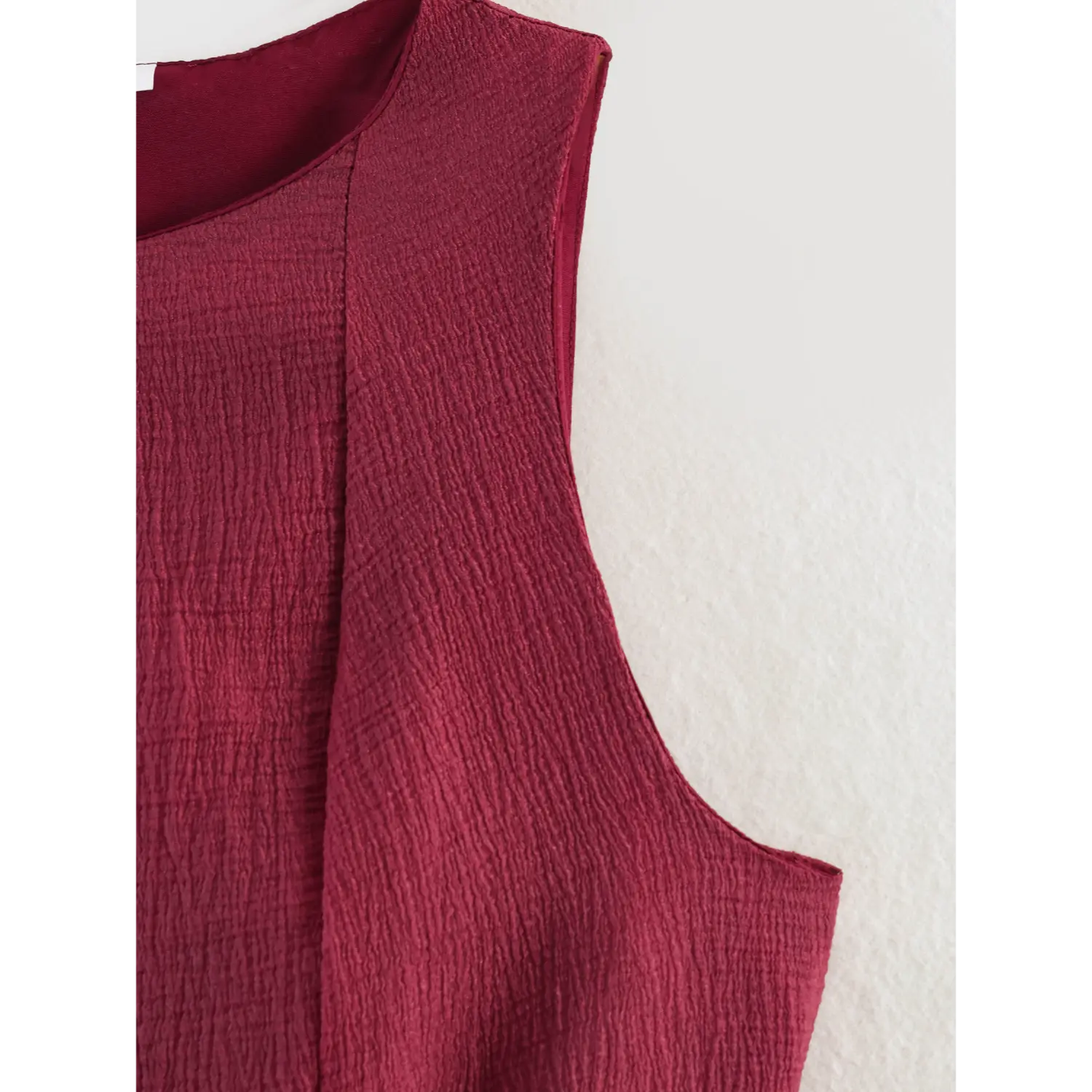 Torso partial shot vertical tailored shaping darts, natural all-over wavy crinkle texture, clean armhole finished edge