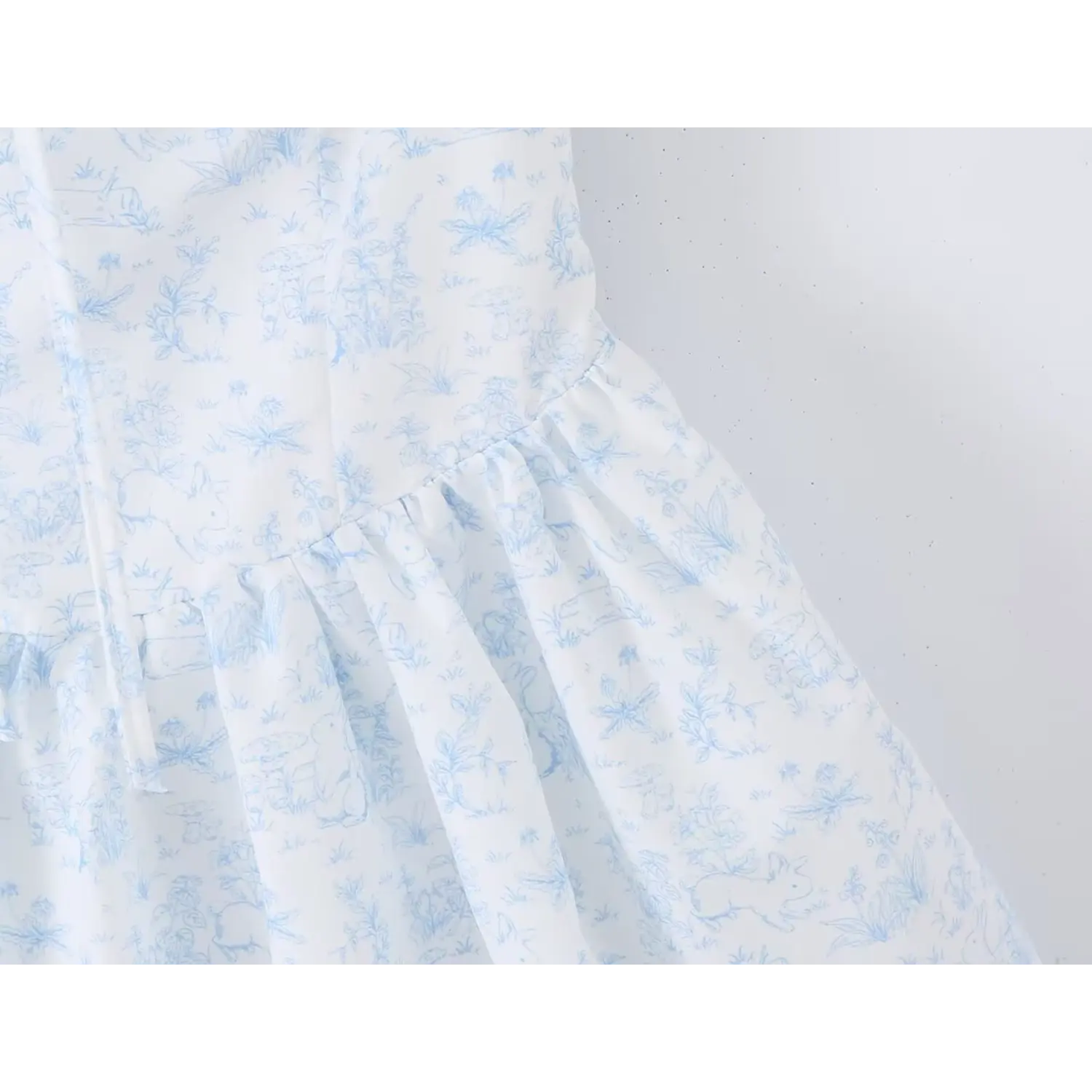 Back flat lay cottagecore sundress, full stretch smocked back panel, elastic ruffle shoulder straps, white blue sketch rabbit botanical print, scalloped lace under hem