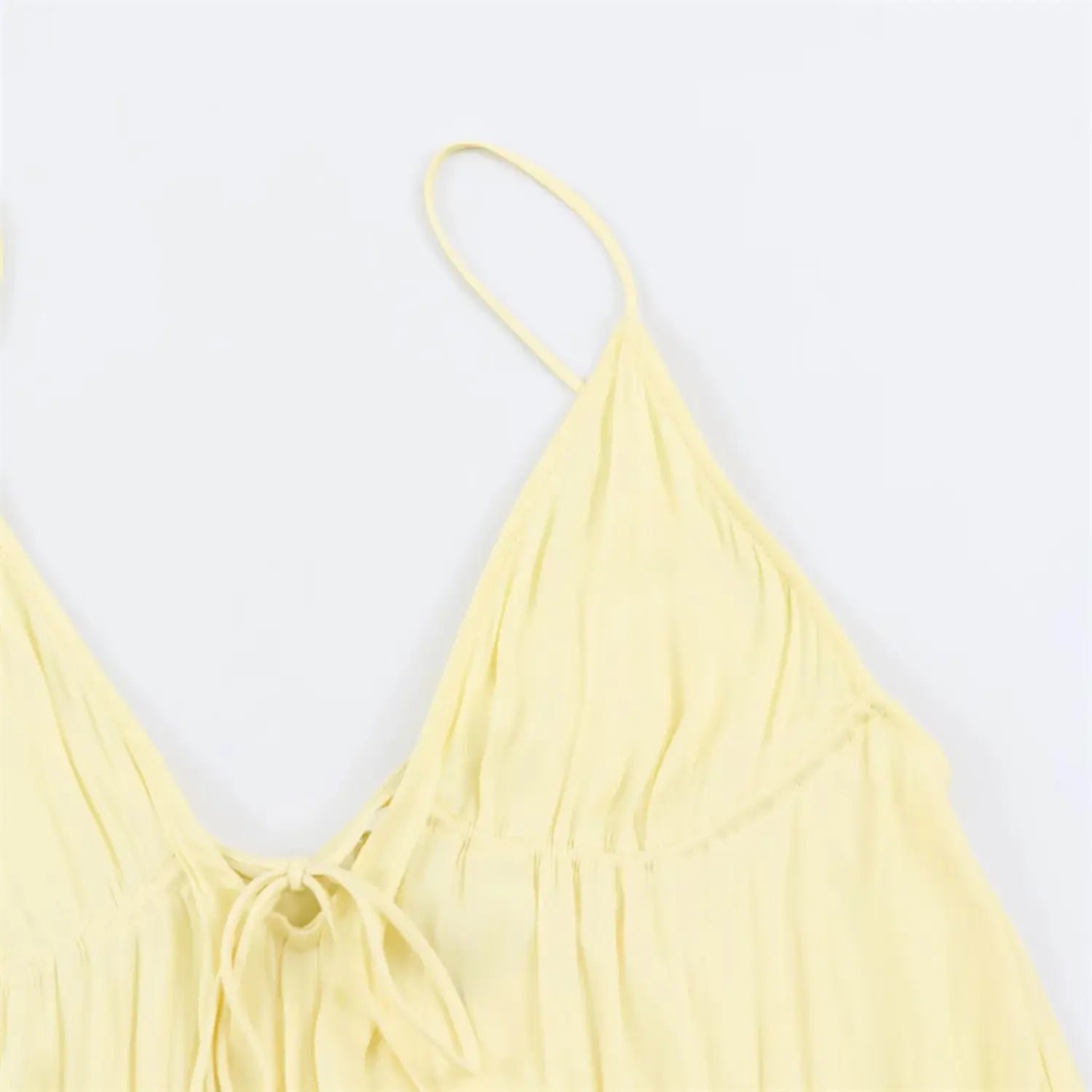 One side thin shoulder strap & V neck partial view, bust gathered pleat draping, slim adjustable strap layout