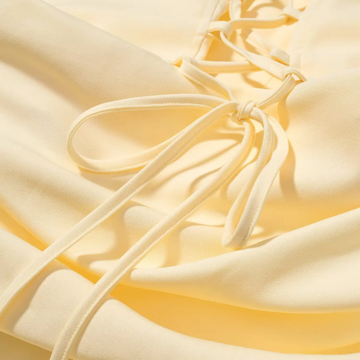 Close-up of lace up back bow tie