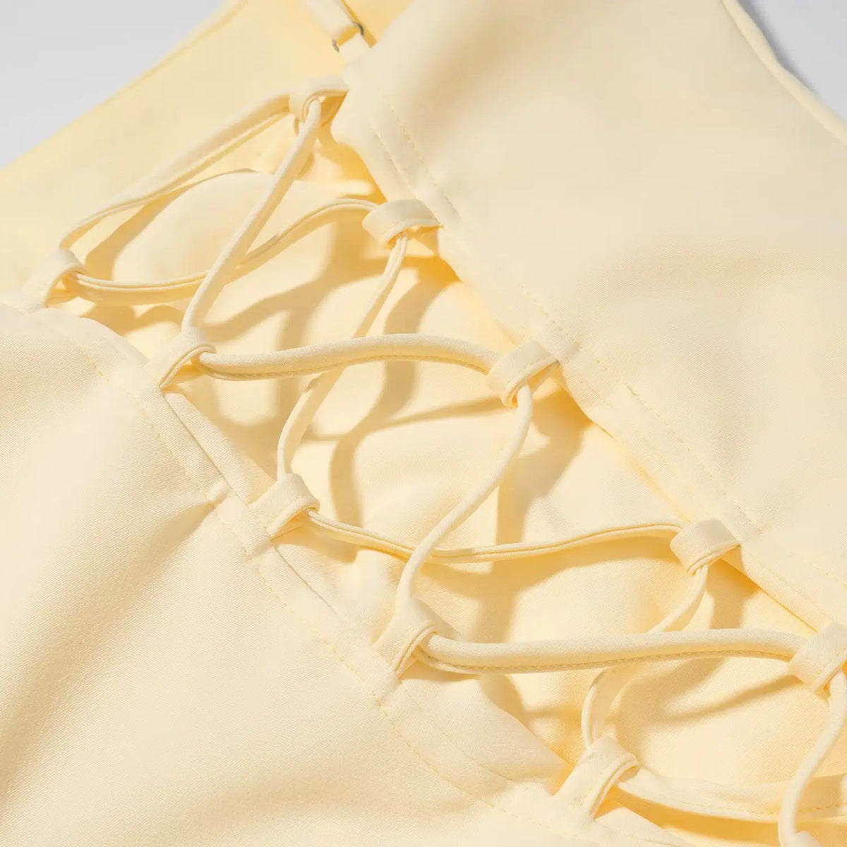 Close-up of lace up back cross straps