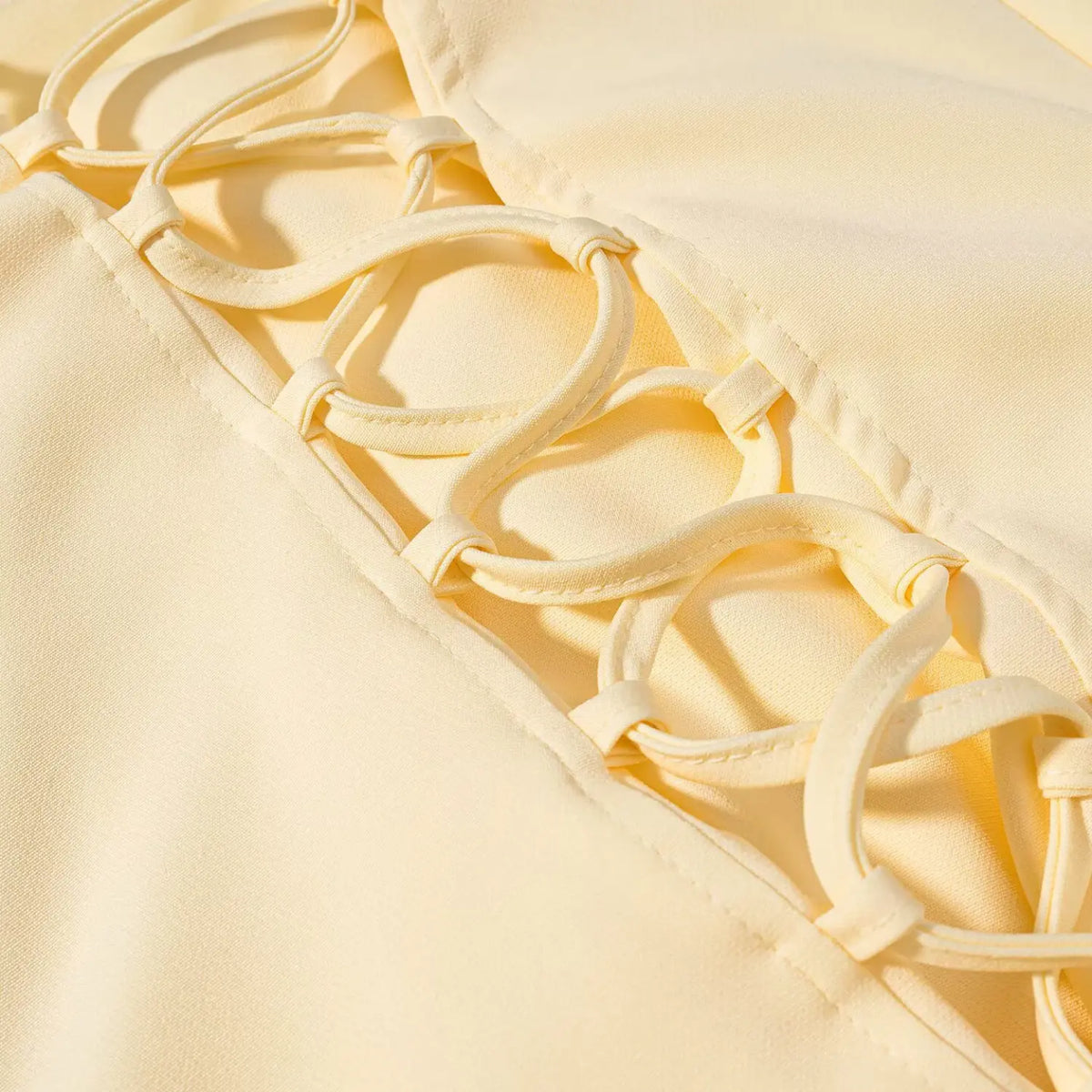 Close-up of lace up back cross straps