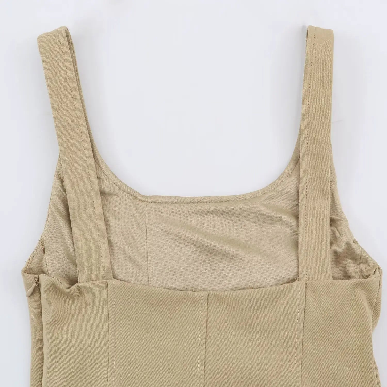 Back close-up of wide square shoulder straps, scoop back neck and smooth inner lining