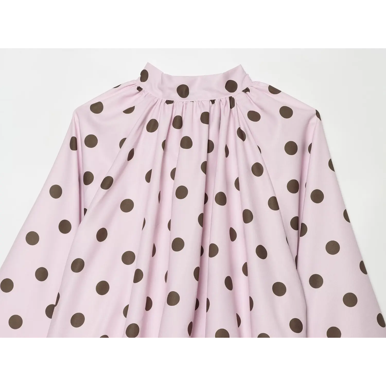 Neckline close-up, plain stand collar, neck gathering detail, pink brown polka dot smooth fabric