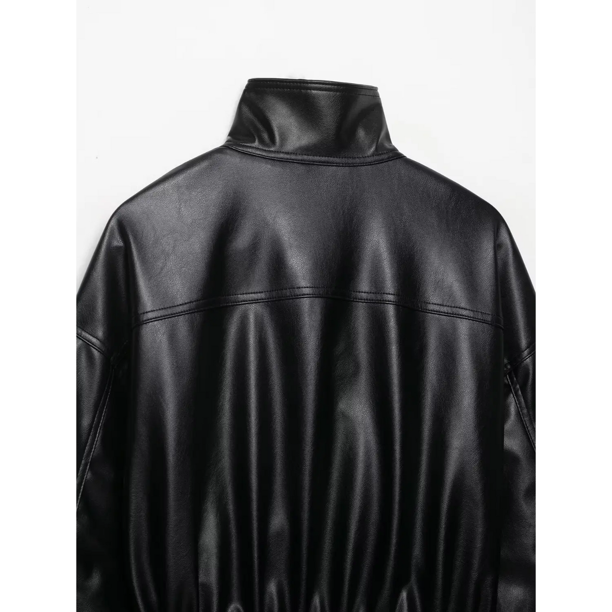Close-up of black back stand collar and shoulder stitching