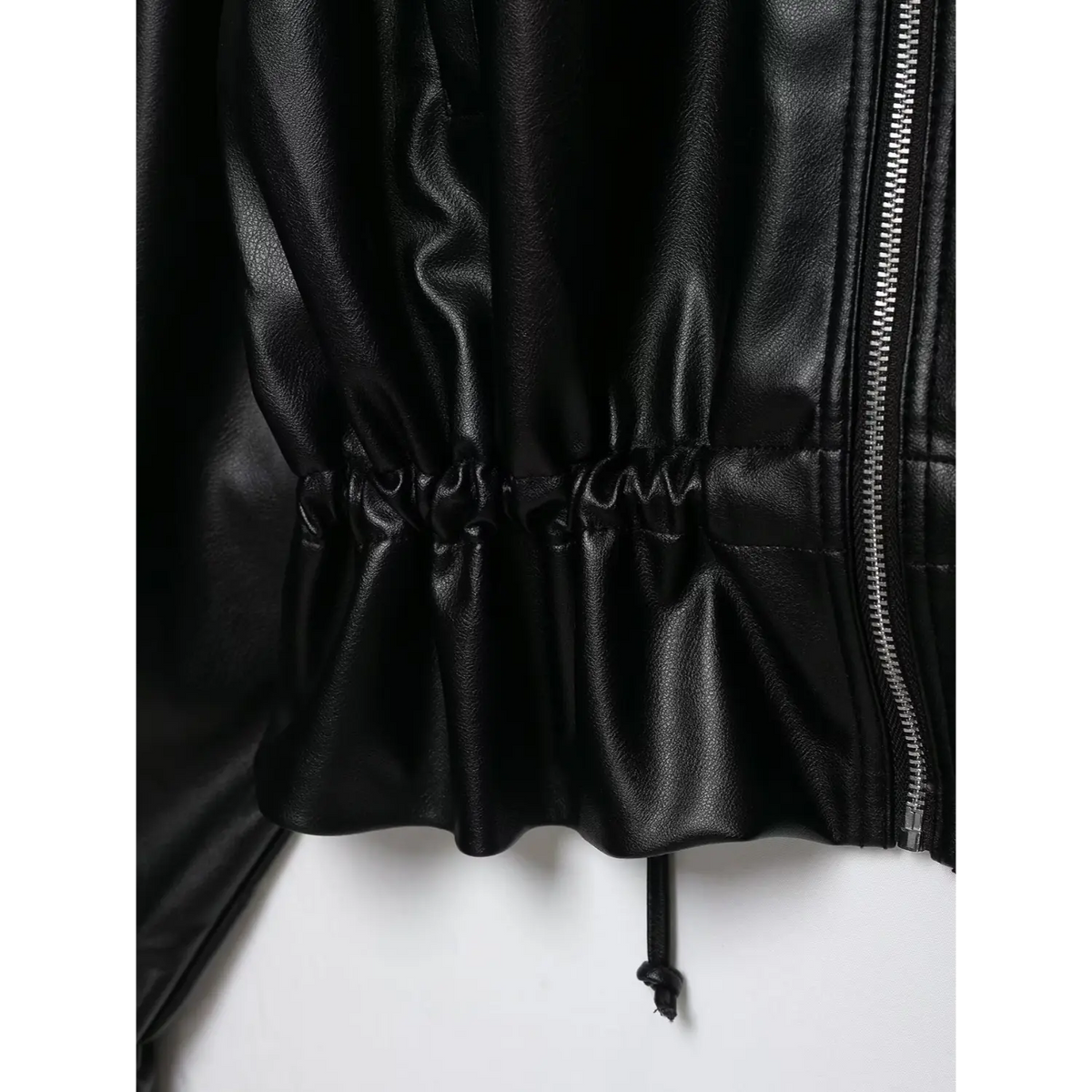 Close-up of black elasticated hem and drawstring