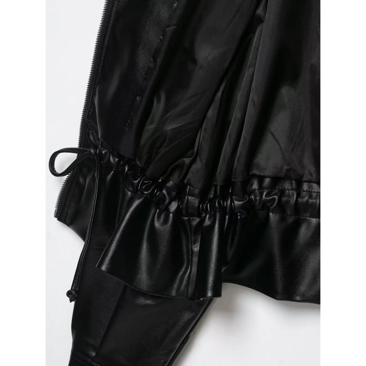Close-up of black elasticated hem and lining