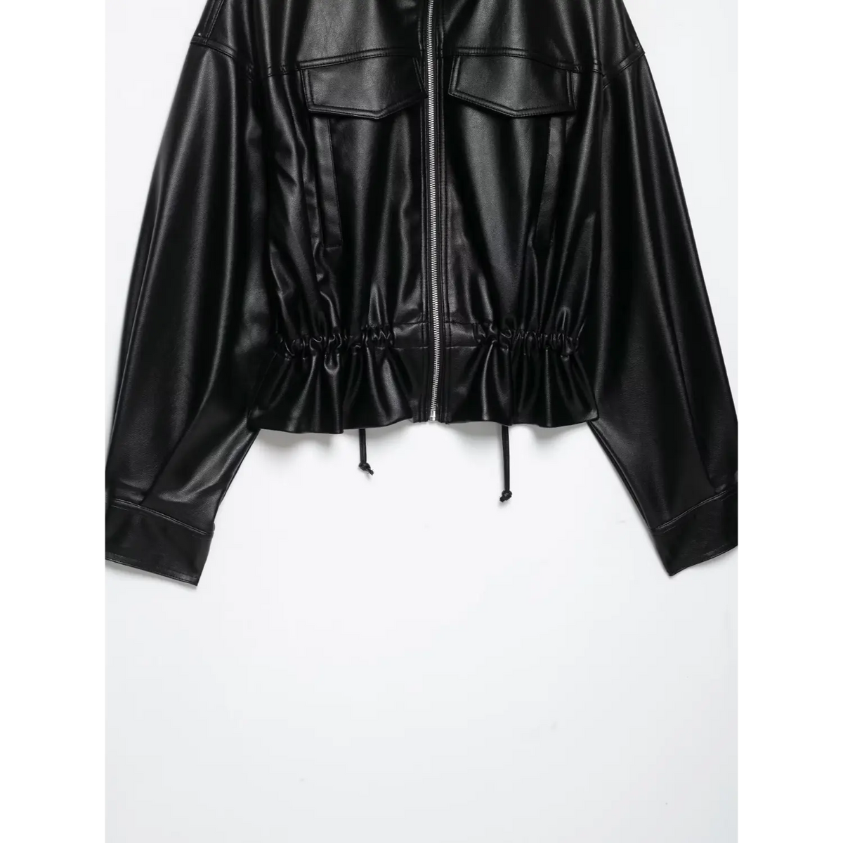 Close-up of black front zip and elasticated hem