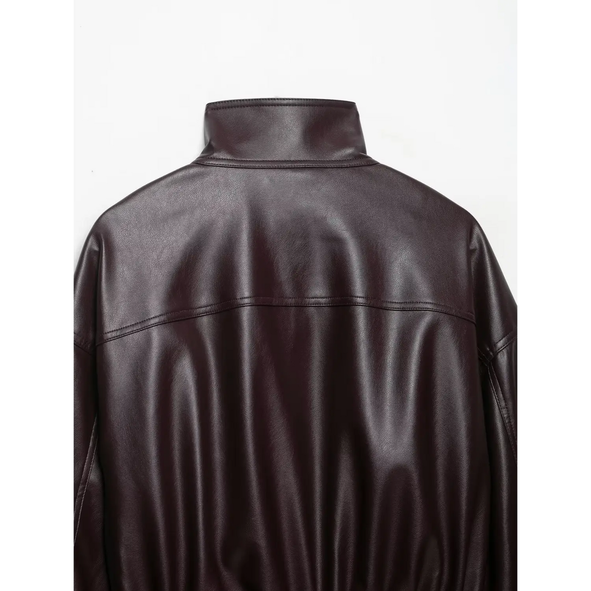 Close-up of burgundy back stand collar and shoulder stitching