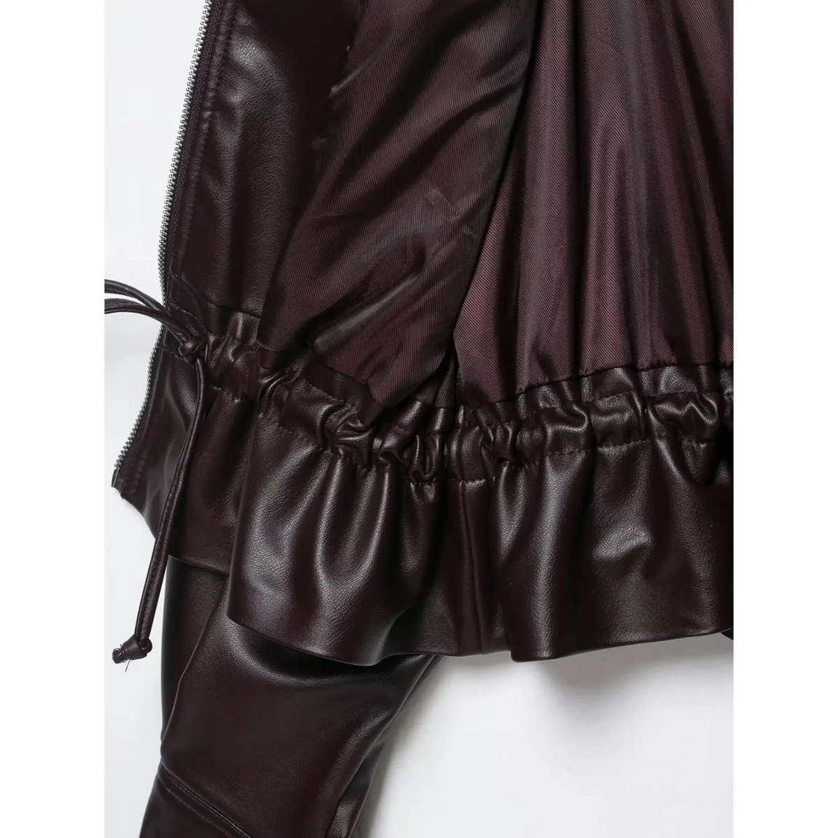 Close-up of burgundy elasticated hem and lining
