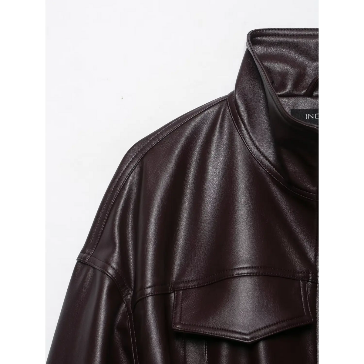 Close-up of burgundy dropped shoulder and chest flap pocket