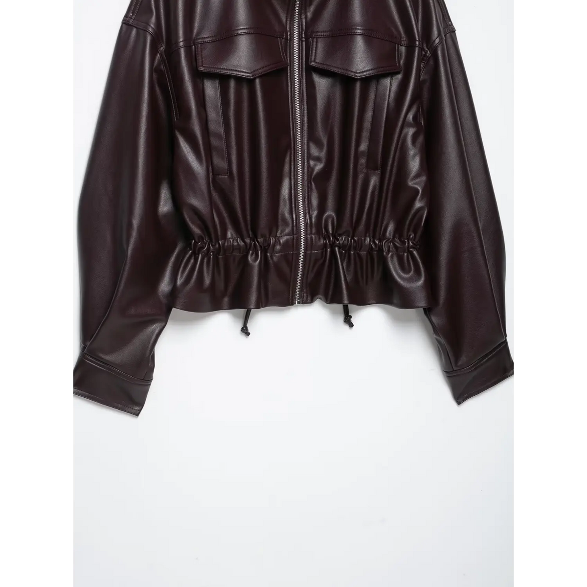 Close-up of burgundy front zip and elasticated hem