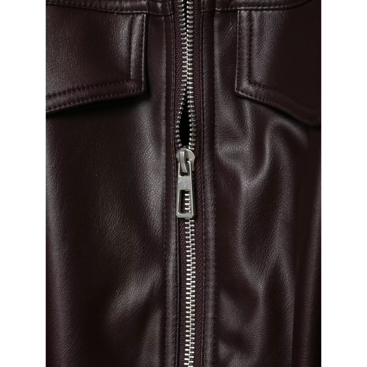 Close-up of burgundy metal zipper pull