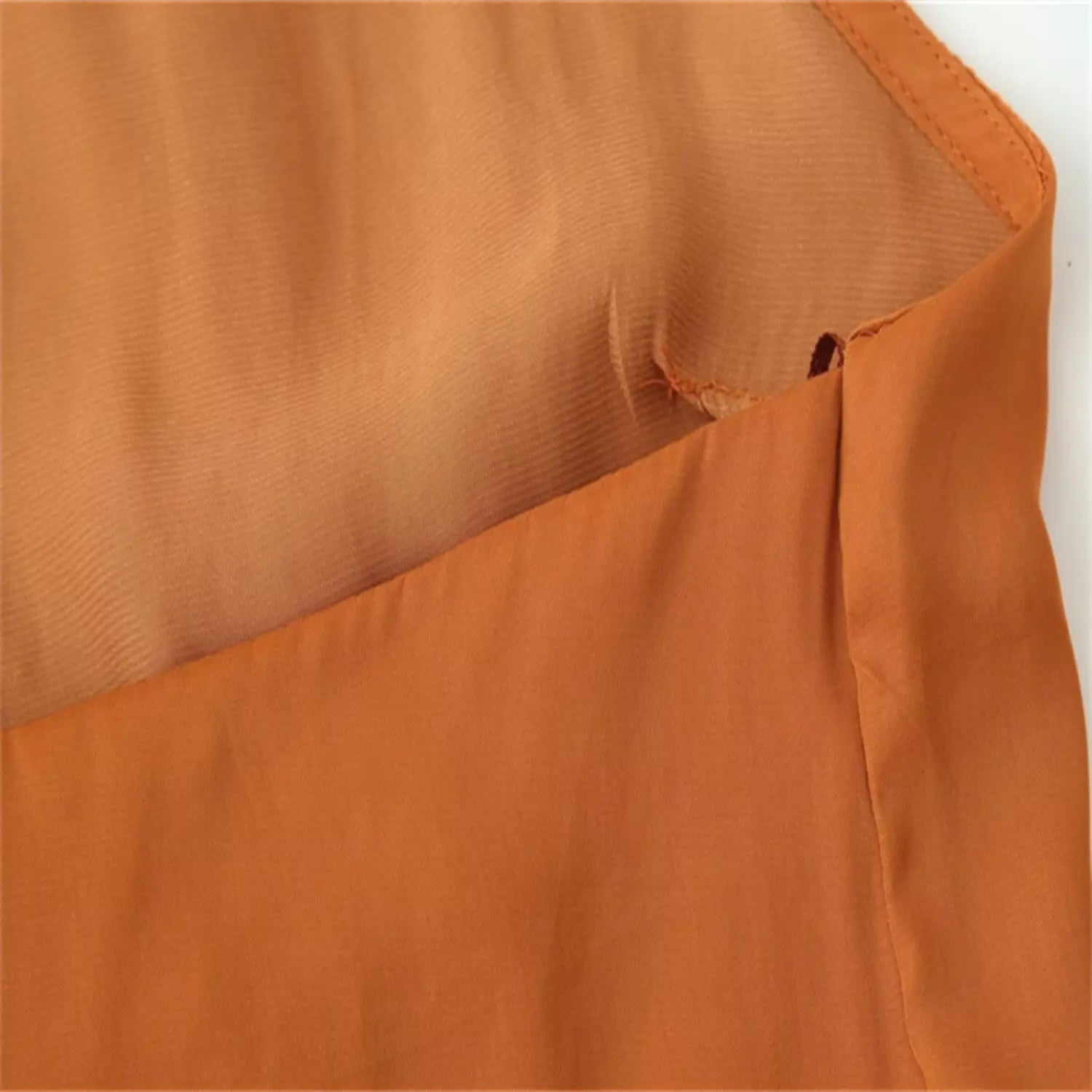 Bottom edge flat shot with uniform finished hem stitching