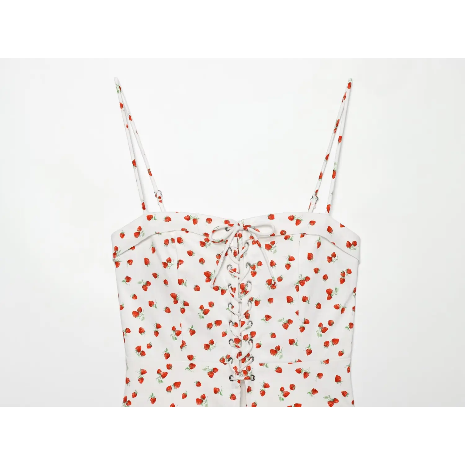 Close‑up shot of bust lace‑up tie detail on white strawberry printed camisole top